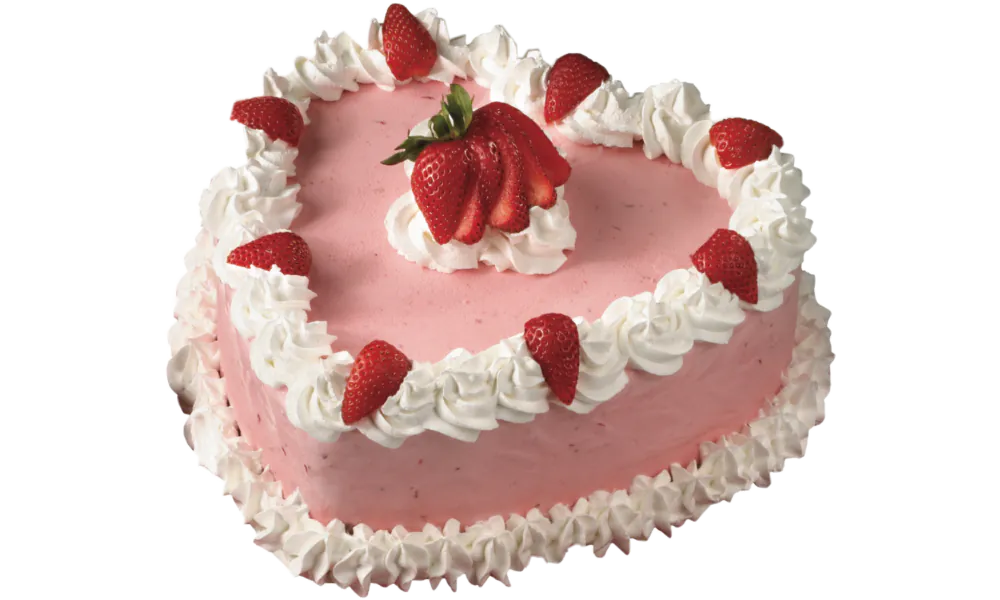 Heart-shaped cake with strawberry frosting and fresh berries at Mom's Bakery & Cafe, a Bakery in El Monte